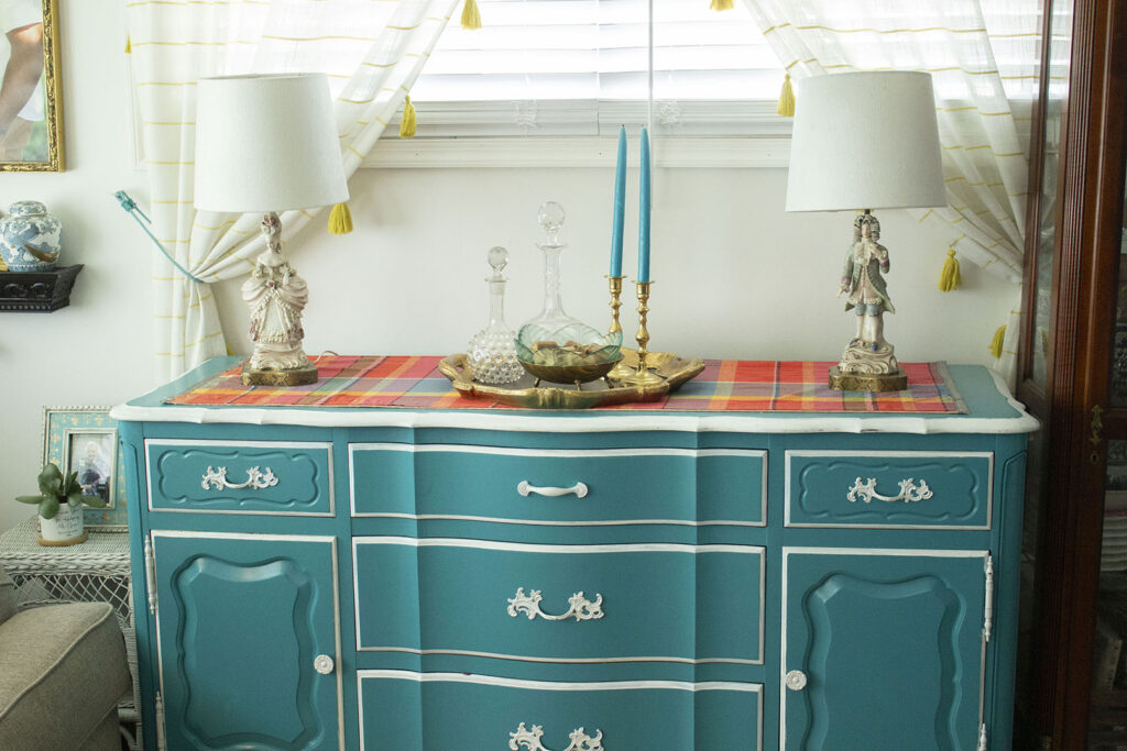 Turquoise blue buffet table  styled with French figurine lamps