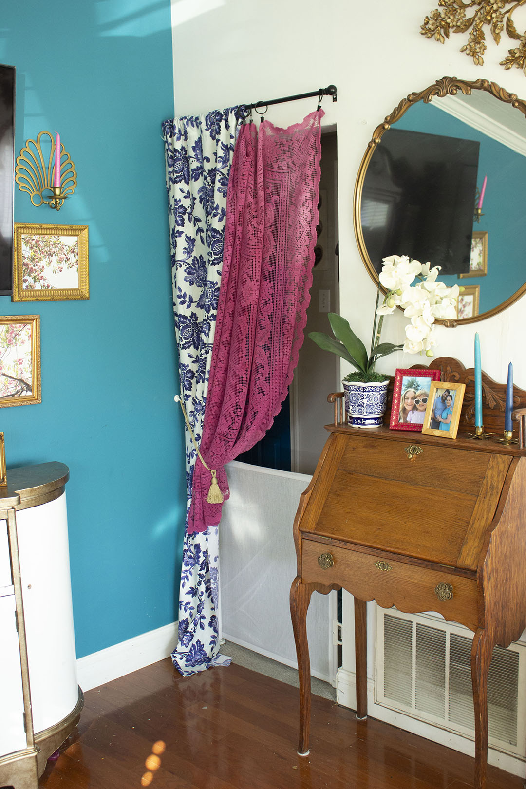 Doorway covered by pink and blue curtains