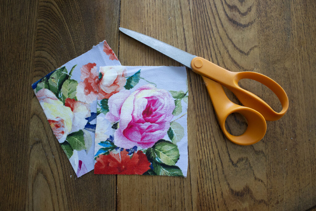 Two square pieces of scrap fabric and scissors