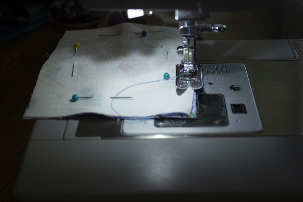 Fabric going through sewing machine