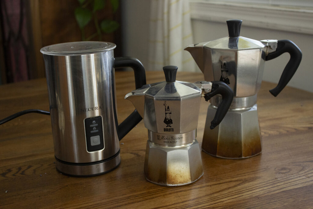 Two moka pots with automatic milk frother