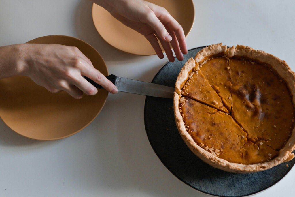 8 ways to reduce waste: Woman cutting into pie