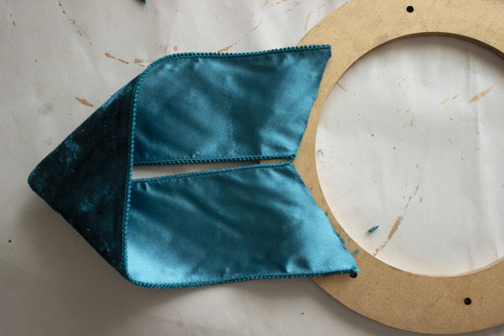 Ribbon glued to wooden wreath frame