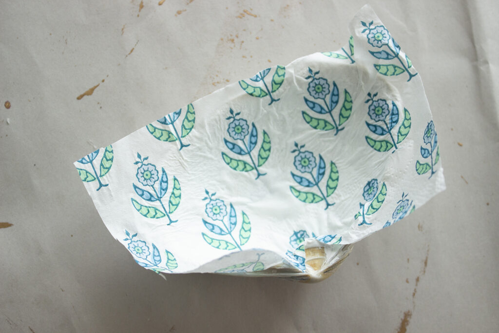 Seashell with napkin being glued inside