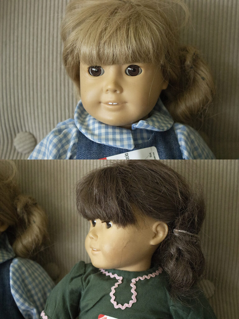 Closeup of two American Girl dolls