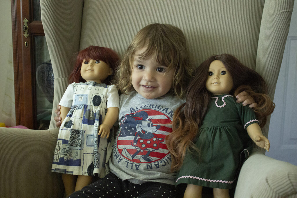 My daughter with her American Girl dolls