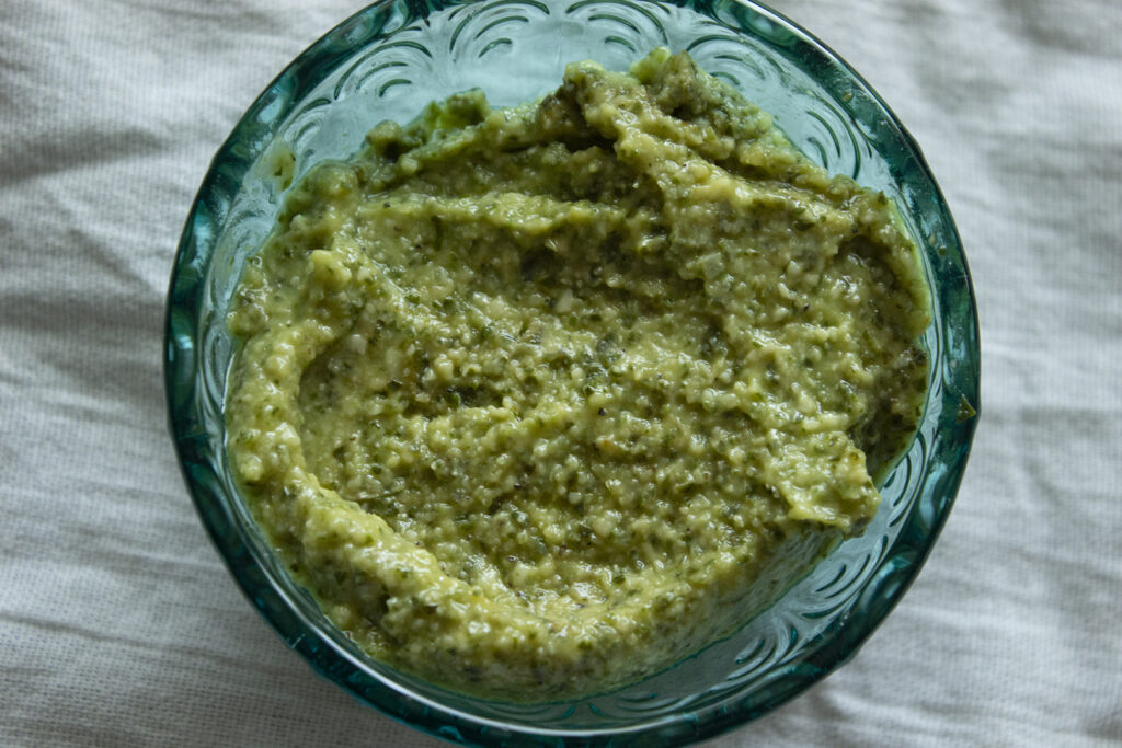 Basil Pesto in Blue Container