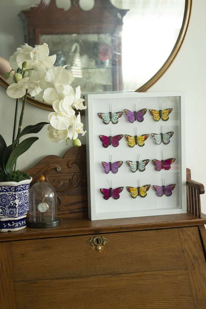 Butterfly Craft: White shadowbox filled with colorful faux butterflies