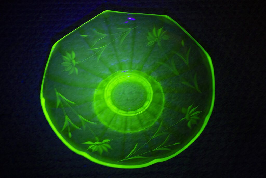 Green uranium glass glowing in the dark