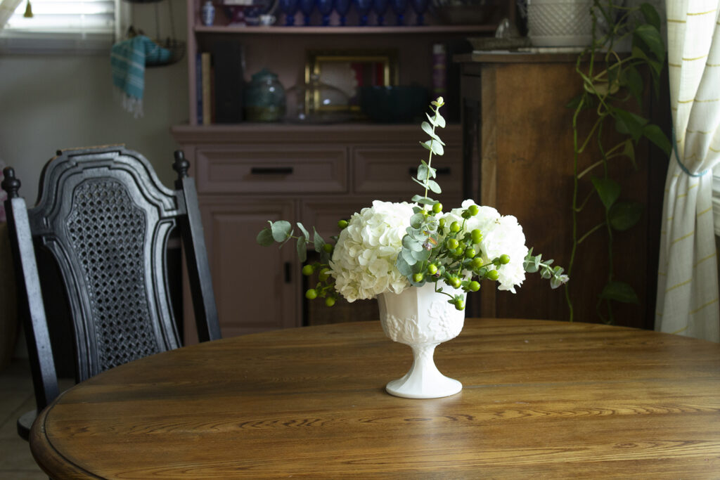 How to Arrange Flowers: Hydrangea arrangement on a wooden kitchen table