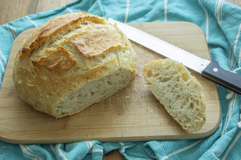 Best Bread Recipes: Cut open loaf of rosemary garlic artisan bread