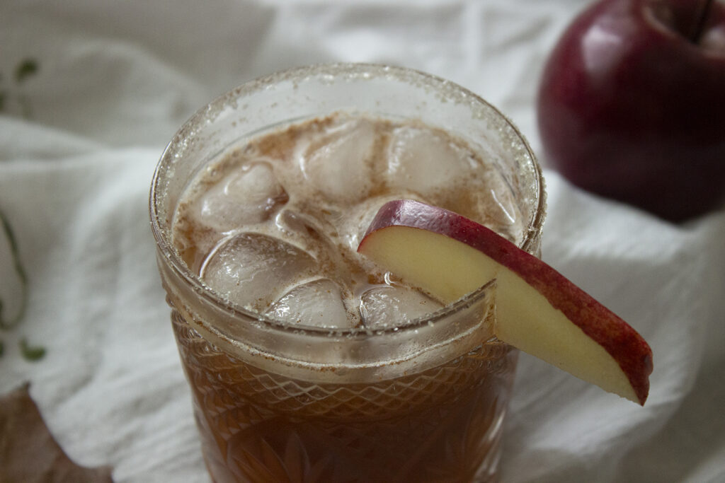 Closeup of fall beverage with apple slice