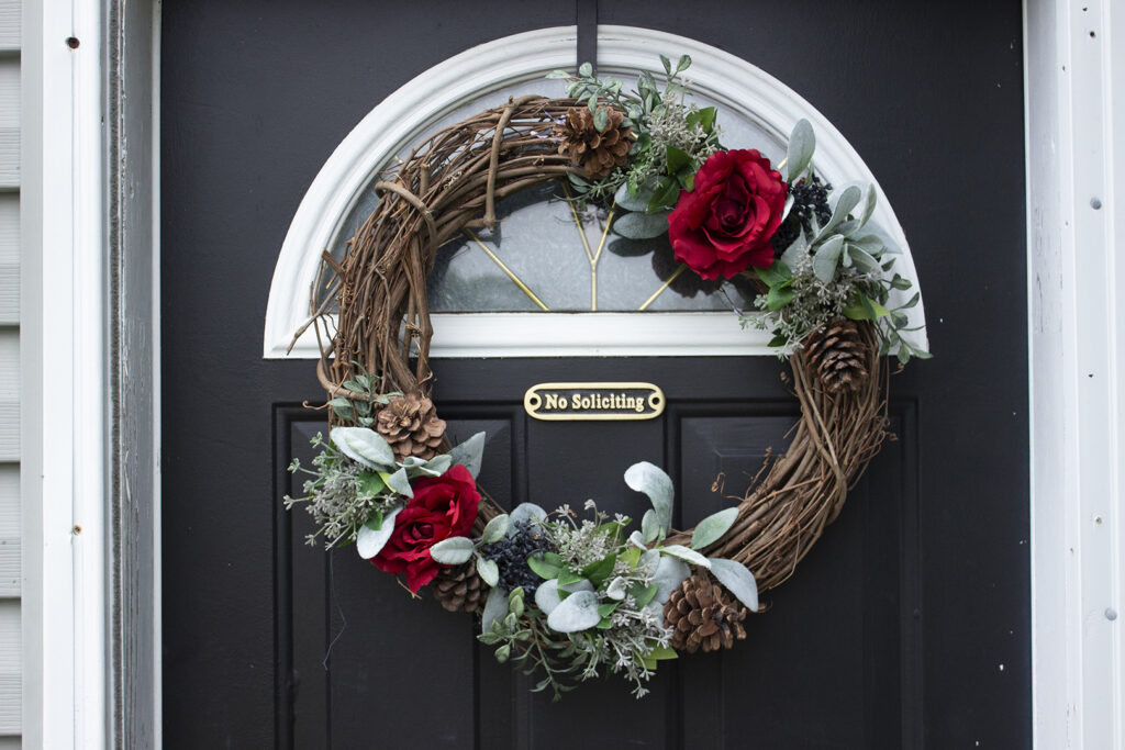 Winter Wreath ideas: wreath of red roses, pine cones, and berries