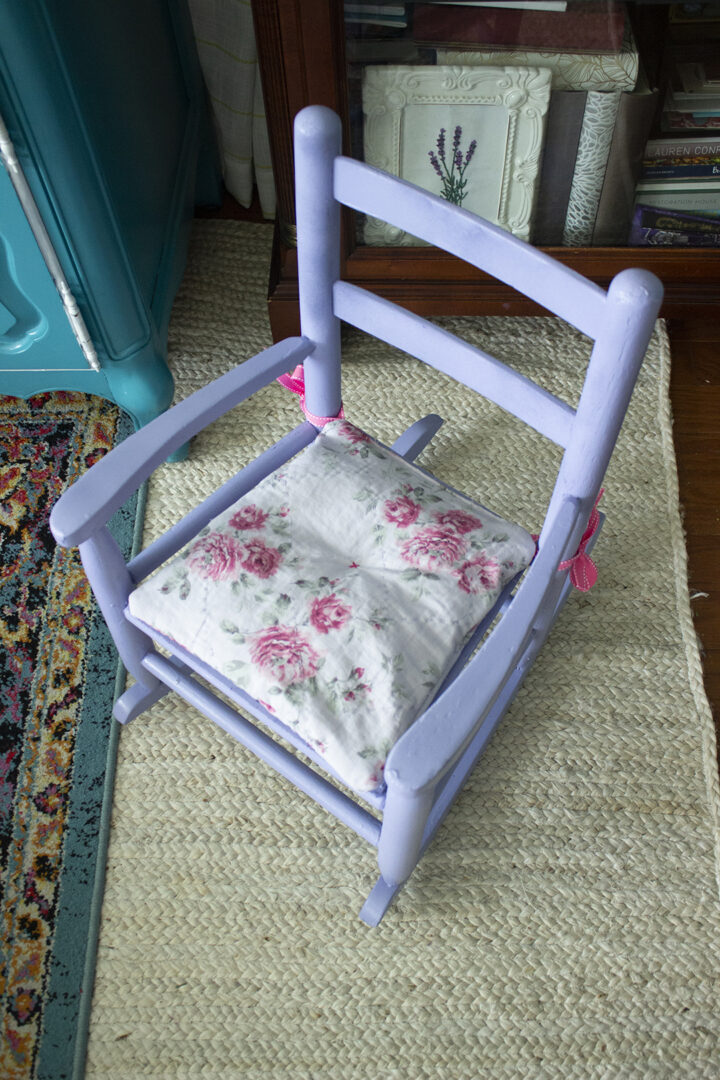Closeup of seat cushion on a child's rocking chair thrift flip