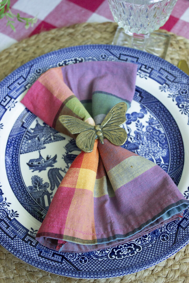 Butterfly napkin ring on madras plaid napkin