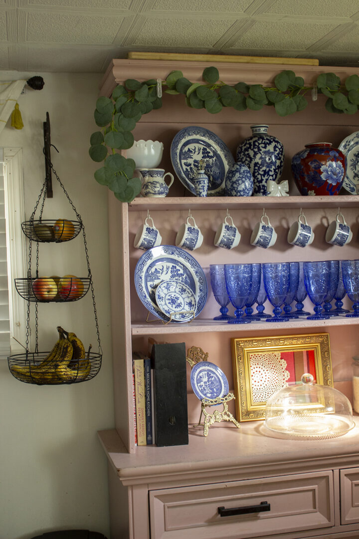 Pink hutch filled with blue and white china
