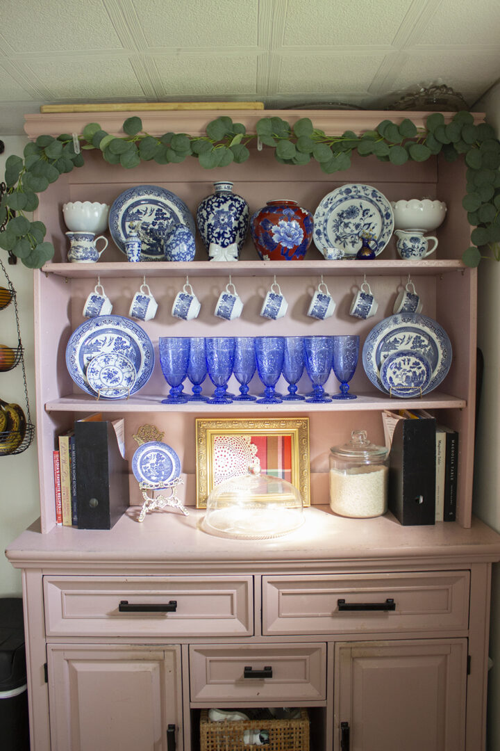 How to Style a Hutch: Pink hutch filled with blue and white china
