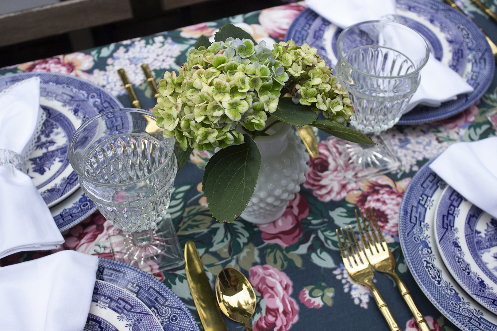 Summer tablescape ideas: Fresh cut hydrangeas in a white hobnail milk glass vase