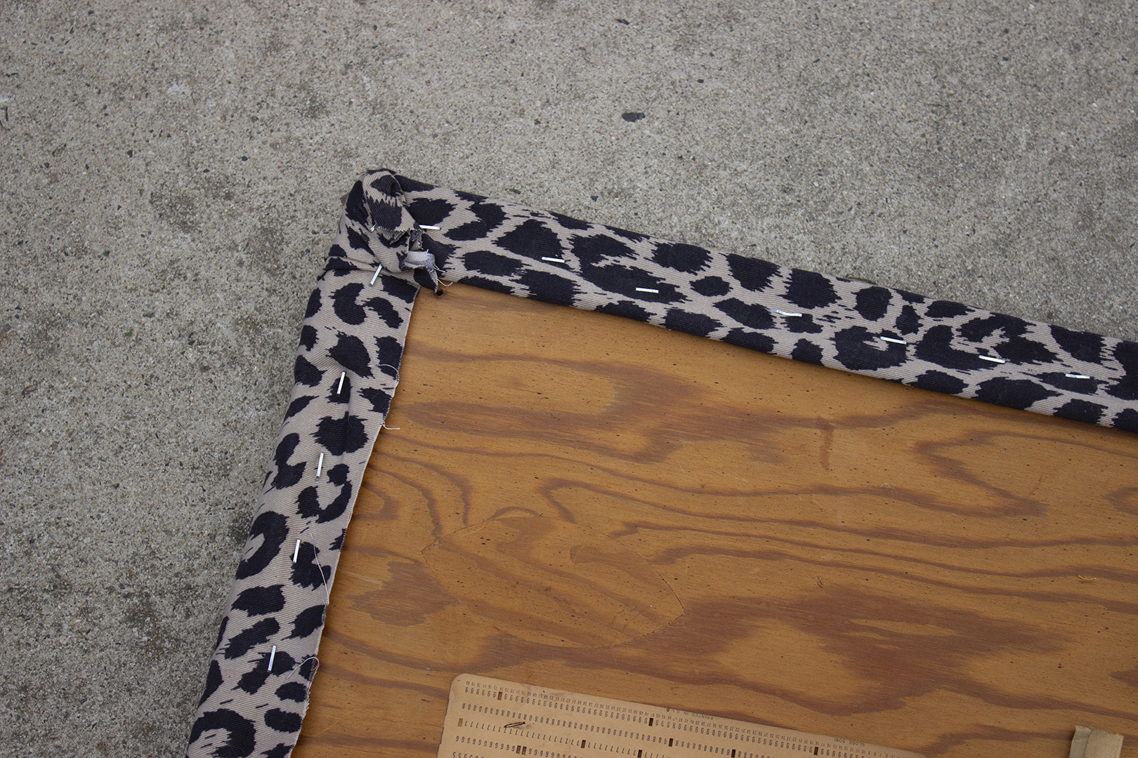 bench makeover: fabric stapled around bench seat