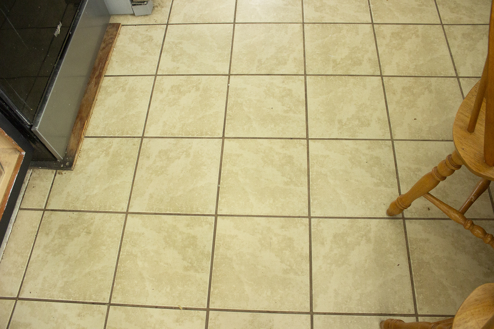 Dirty grout on kitchen floor